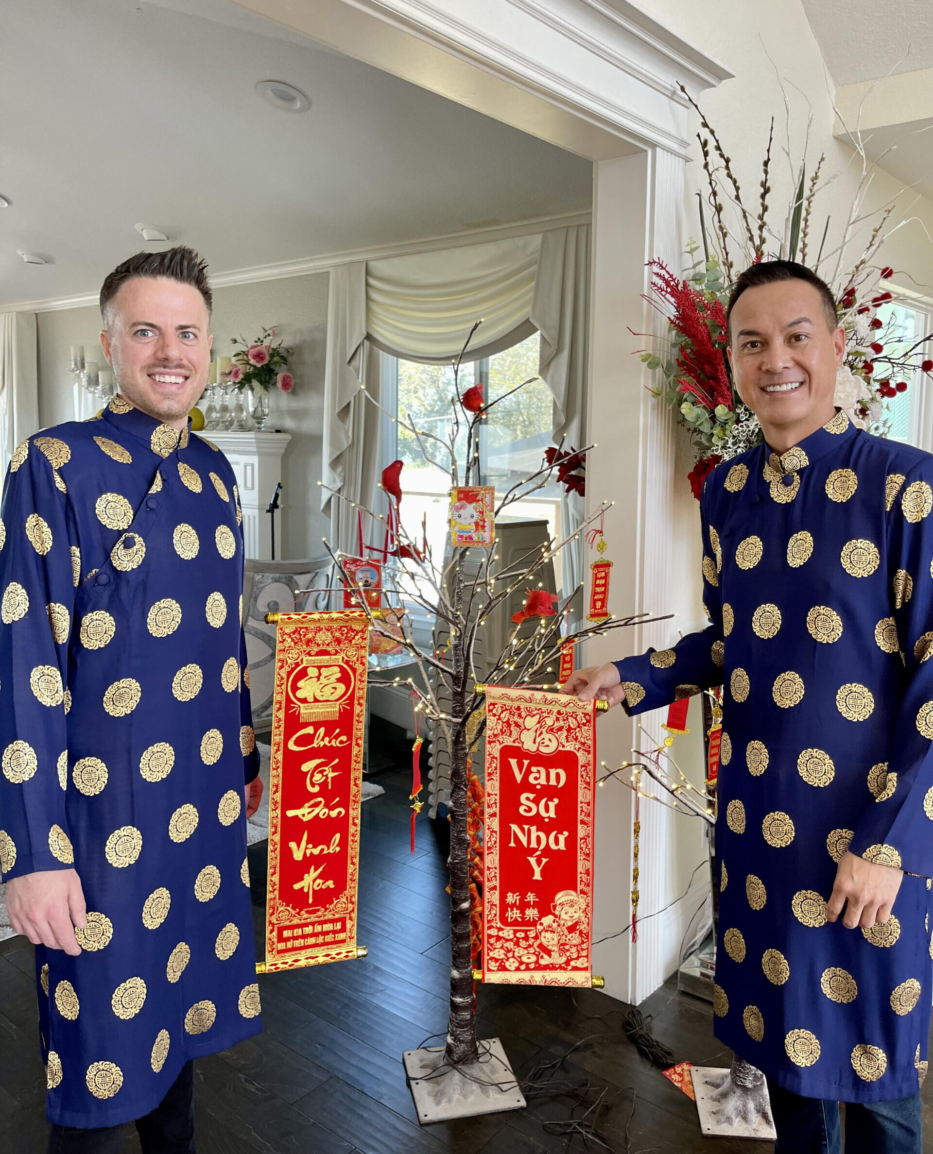 The couple wearing their áo dais for Tết, wishing in blessings and prosperity.
